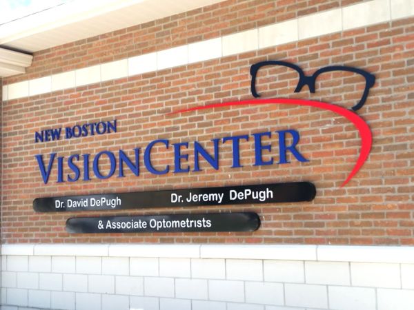 Colorful custom dimensional building sign built by Sun Sign Company