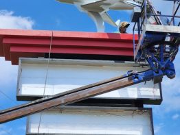 Our welder working inside the roof structure to secure the jet to the frame work of the pylon