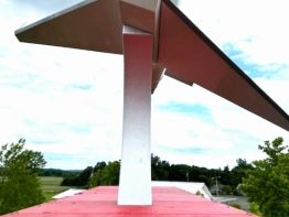 Steel fabricated mount to hold our jet - Suny1 -in a graceful upward-banked climb atop the roof structure of the Greater Portsmouth Regional Airport pylon sign