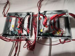 Each letter or sign element has it's own low voltage feed line.  Power comes into the power supplies as 120v and leaves as 12v