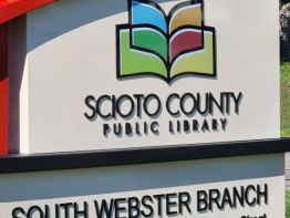 Logo digitally printed on black stud-mounted acrylic  for this Aluminum Monument Sign built by Sun Sign Company for the entrance to the South Webster, Ohio branch of the Scioto County Public Library