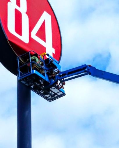 Sun Sign Company refacing a pole sign at 84 Lumber, Portsmouth, OH